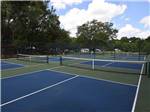 Blue pickleball courts at WILLISTON CROSSINGS RV RESORT - thumbnail