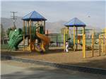 Kids playing at the playground at REFLECTION LAKE RV PARK & CAMPGROUND - thumbnail