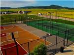 View larger image of Basketball and tennis courts at ELKHORN RIDGE RV RESORT  CABINS image #5