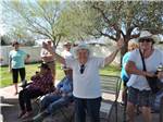 View larger image of A group of people cheering at LAZY PALMS RANCH RV PARK image #9