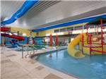 Indoor pools with slides at GOVERNORS' RV PARK CAMPGROUND - thumbnail