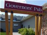 View larger image of Governors Pub sign leading to watering hole at GOVERNORS RV PARK CAMPGROUND image #4