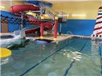 View larger image of The indoor pool water slide at GOVERNORS RV PARK CAMPGROUND image #5