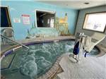 The indoor hot tub with a ADA chair at GOVERNORS' RV PARK CAMPGROUND - thumbnail