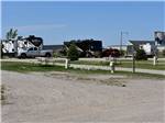 View larger image of View of RV sites along with buildings in background at GOVERNORS RV PARK CAMPGROUND image #12