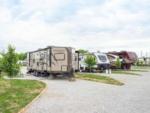 A row of trailers in paved sites at HERITAGE ACRES RV PARK - thumbnail