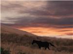 Orange sunset over the hills at Klamath Ranch Resort / Blue Heron RV Park - thumbnail