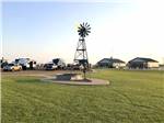 A windmill with RV sites nearby at WESTERN STAR RV RANCH - thumbnail