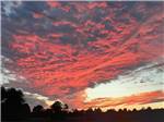 An orange cloudy sky at dusk at DAN RIVER CAMPGROUND - thumbnail