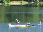 People kayaking on the lake at WAUBEEKA FAMILY CAMPGROUND - thumbnail