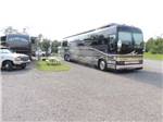 View larger image of Bus conversion on site with picnic table at IVYS COVE RV RETREAT image #2