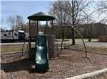 The playground with a slide and swings - thumbnail
