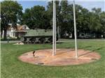 View larger image of Flag poles and vintage military tank at BAILEYS RV RESORT image #6
