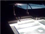 The hot tub and pool at night at The RV Resort at Carolina Crossroads - thumbnail