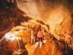 A family walking through one of the caves nearby at ENDLESS CAVERNS - thumbnail
