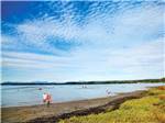 View larger image of Campers on the beach at BIRCH BAY RESORT -THOUSAND TRAILS image #2
