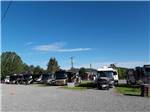A row of gravel RV sites at OLD WEST RV PARK - thumbnail