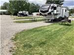 A fifth wheel trailer in a RV site at OLD WEST RV PARK - thumbnail