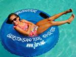 Girl in an inner tube floating at JAMAICA BEACH RV RESORT - thumbnail