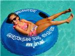 View larger image of Girl relaxing in inner tube at JAMAICA BEACH RV RESORT image #6