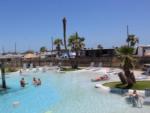 People sunbathing at the pool at JAMAICA BEACH RV RESORT - thumbnail