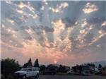 View larger image of Sunset with clouds over the RV sites at MOUNTAIN VIEW RV PARK image #2