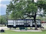 RV sites with fire pit and table at STARS OVER TEXAS RV PARK - FRIO - thumbnail