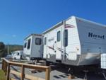 Travel trailer parked at a site at MOUNTAIN GLEN RV PARK & CAMPGROUND - thumbnail