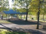 Gathering area with corn hole at MOUNTAIN GLEN RV PARK & CAMPGROUND - thumbnail