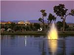 View larger image of Lighted fountain in the lake at dusk at ISLETA LAKES  RV PARK image #5