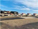 One of the empty paved pull thru RV sites at OASIS RV RESORT - thumbnail