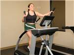 View larger image of A young lady enjoying the exercise room at BAKERSFIELD RIVER RUN RV PARK image #8