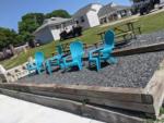 Four blue chairs next to picnic benches at BRIARCLIFFE RV RESORT - thumbnail
