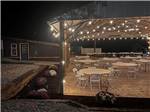 The pavilion at night with hanging patio lights - thumbnail