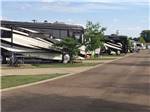 View larger image of A row of paved RV sites at EZ DAZE RV PARK image #6