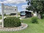 The front entrance sign with a motorhome coming in at LAKESHORE RV RESORT & CAMPGROUND - thumbnail