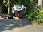 A fifth wheel RV and car at site at Sun Retreats Birch Bay - thumbnail