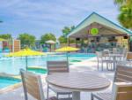 Pool by bar, tables and chairs at CAMP MARGARITAVILLE RV RESORT BREAUX BRIDGE - thumbnail