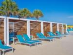 A row of lounge chairs and cabanas at CAMP MARGARITAVILLE RV RESORT BREAUX BRIDGE - thumbnail