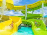 Two girls going down outdoor water slide at CAMP MARGARITAVILLE RV RESORT BREAUX BRIDGE - thumbnail