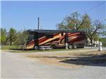 View larger image of A Class A motorhome in an RV site at BENNETTS RV RANCH image #4