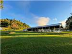 View larger image of A large pavilion in a grassy area at CAMPING WORLD MOUNTAIN RESORT OF MARION image #10