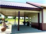 The covered outside sitting area at CROSSROADS RV PARK - thumbnail