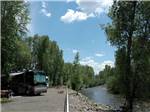 A motorhome overlooking the river at SKY MOUNTAIN RESORT RV PARK - thumbnail