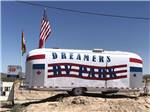 An Airstream with the parks name on it at 3 DREAMERS RV PARK - thumbnail