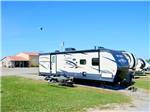 A row of trailers parked in gravel sites at COYOTE VIEW RV PARK & RV REPAIR - thumbnail