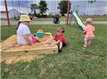 Children playing in sandbox at COYOTE VIEW RV PARK & RV REPAIR - thumbnail