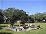 A fire pit with seating at PENSACOLA RV PARK - thumbnail