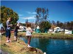 View larger image of Kids fishing at WILDERNESS LAKES RV RESORT image #1
