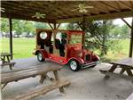 A red truck model under the pavilion at WILLS CREEK RV PARK - thumbnail